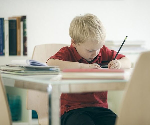 Young Boy Writing
